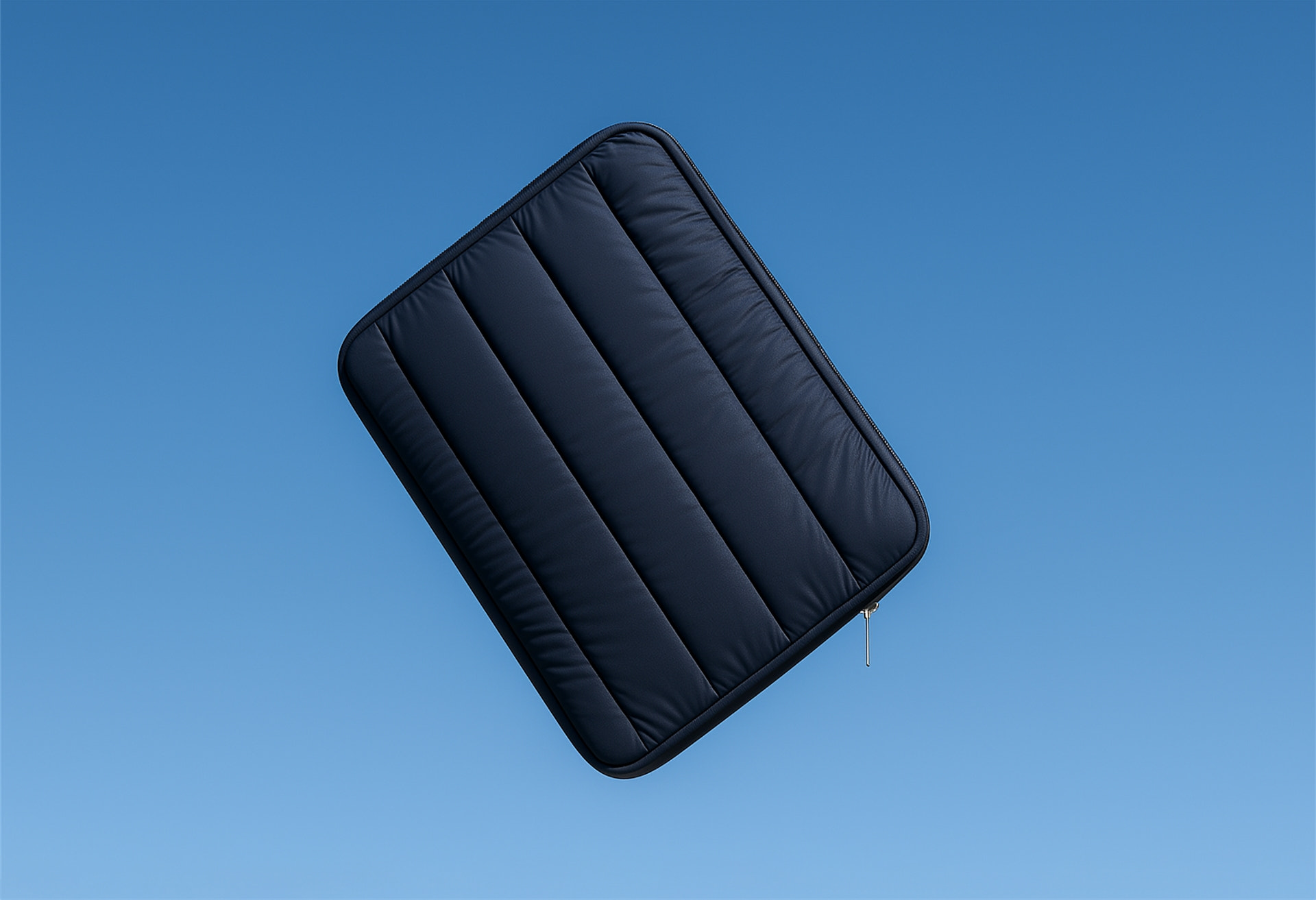 Humley padded laptop sleeve in black – lightweight, protective design on blue backdrop