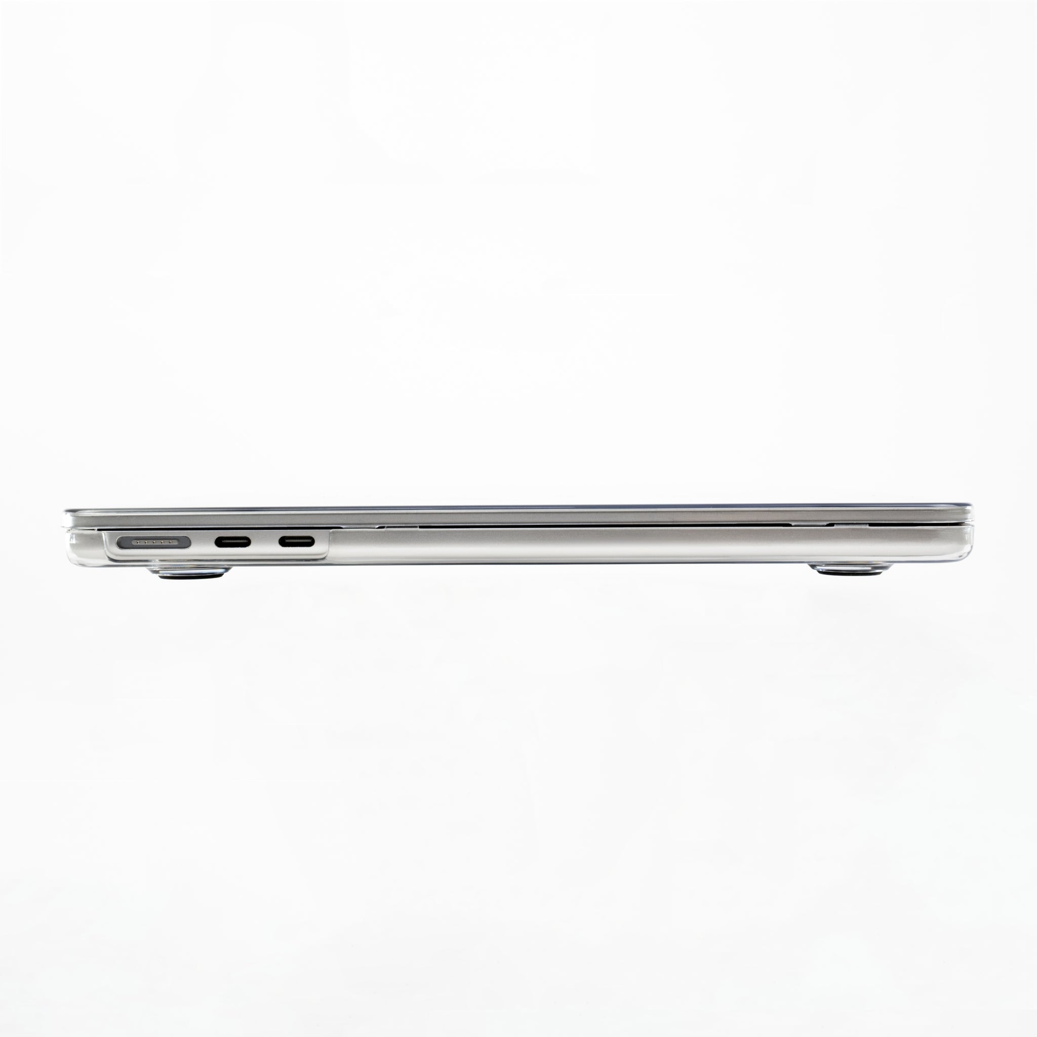 Side profile of MacBook Air M2 with Humley clear hard case showing port access and slim fit
