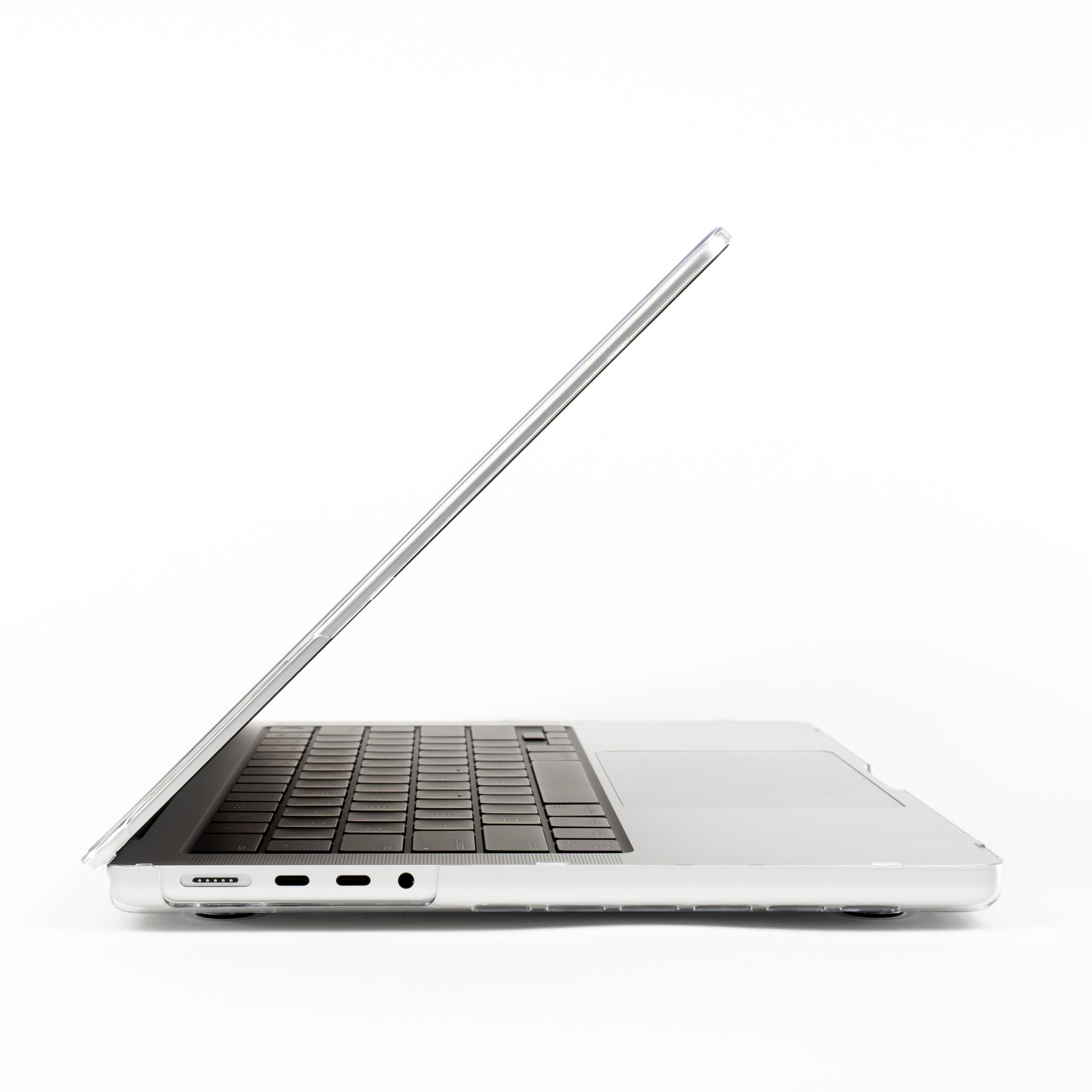 Left-side view of 14-inch MacBook Pro with clear protective hard case showing charging and headphone ports