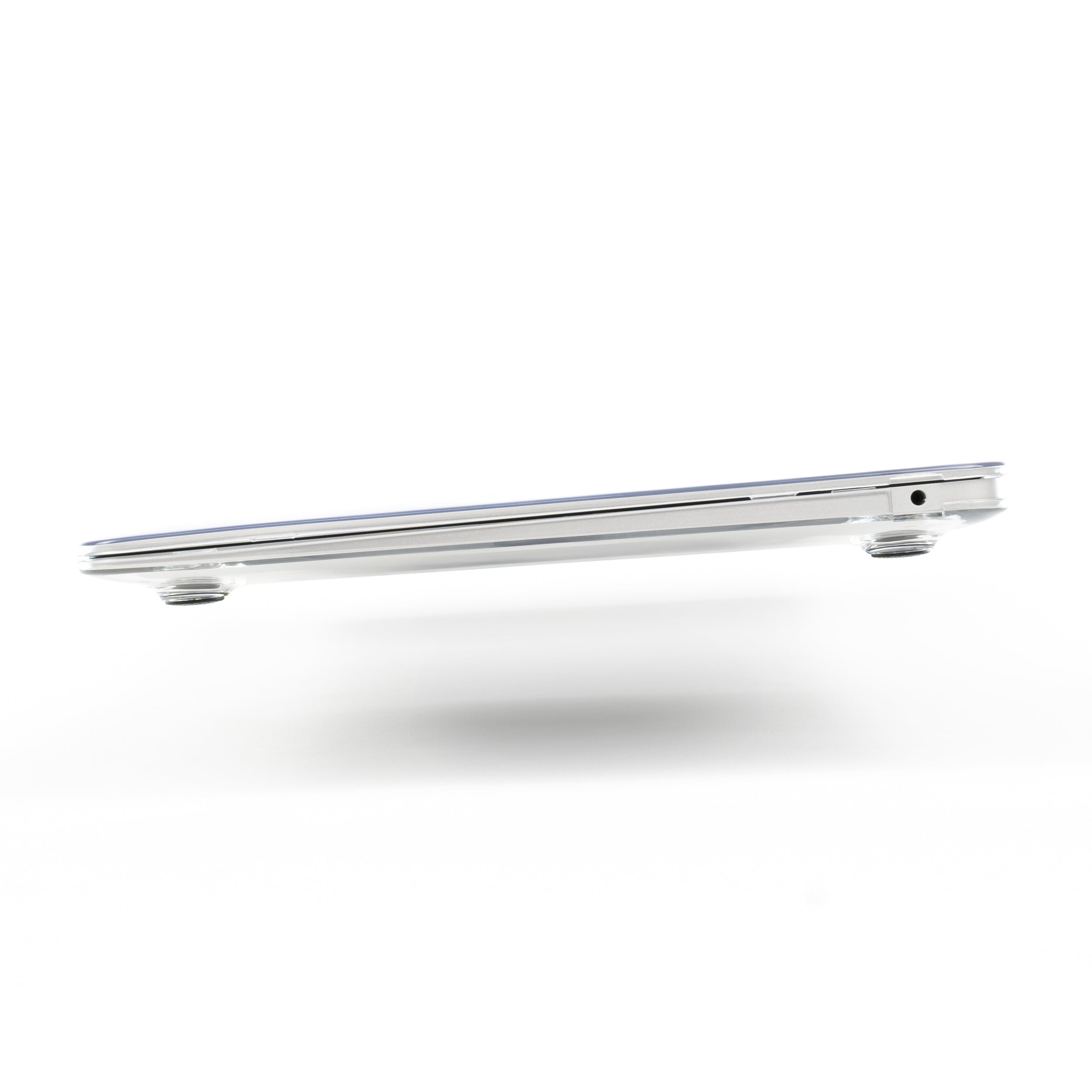Side view of MacBook Air M1 closed with Humley clear hard case, showing slim profile and port alignment