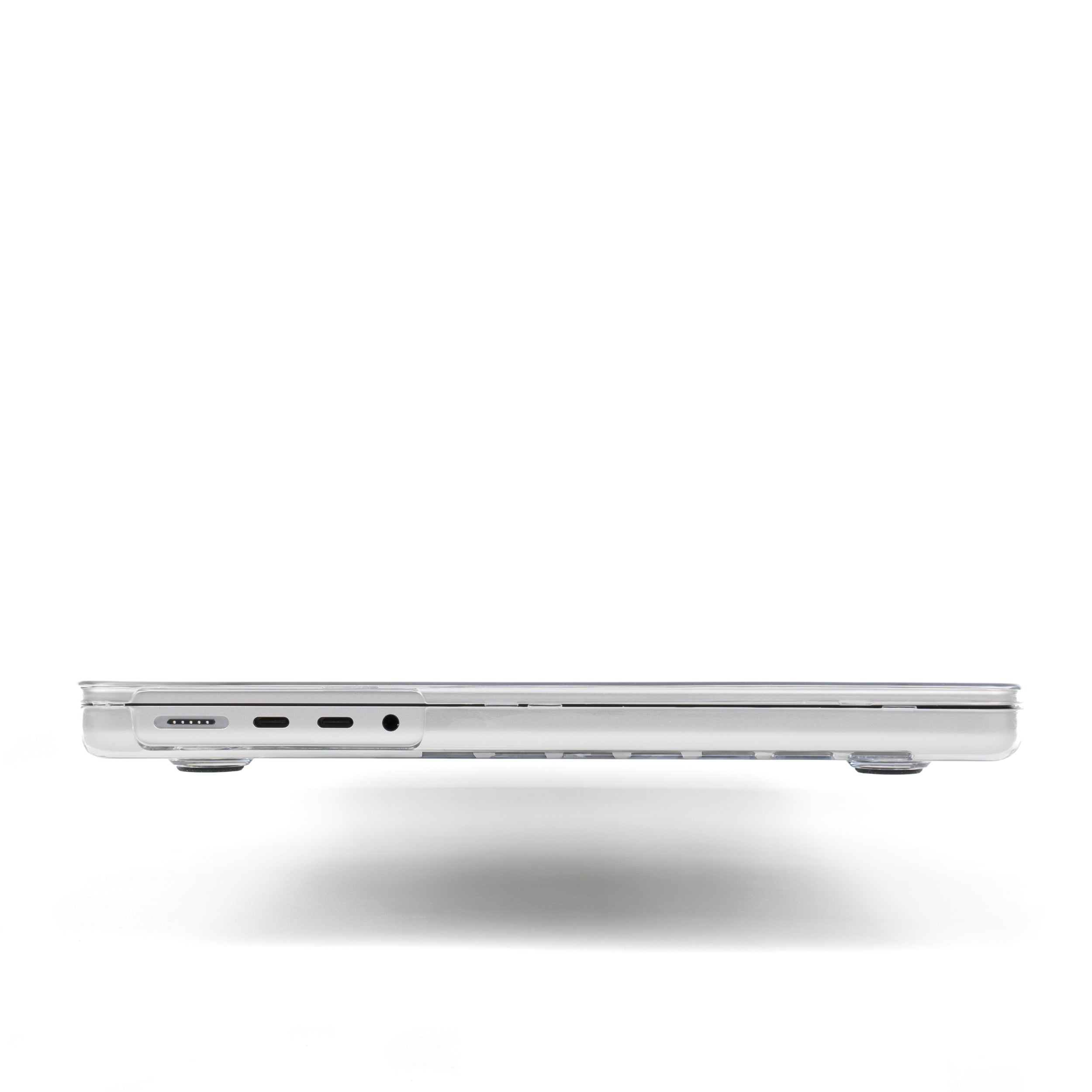 Side view of MacBook with Humley clear hard case showing MagSafe and USB-C port cutouts