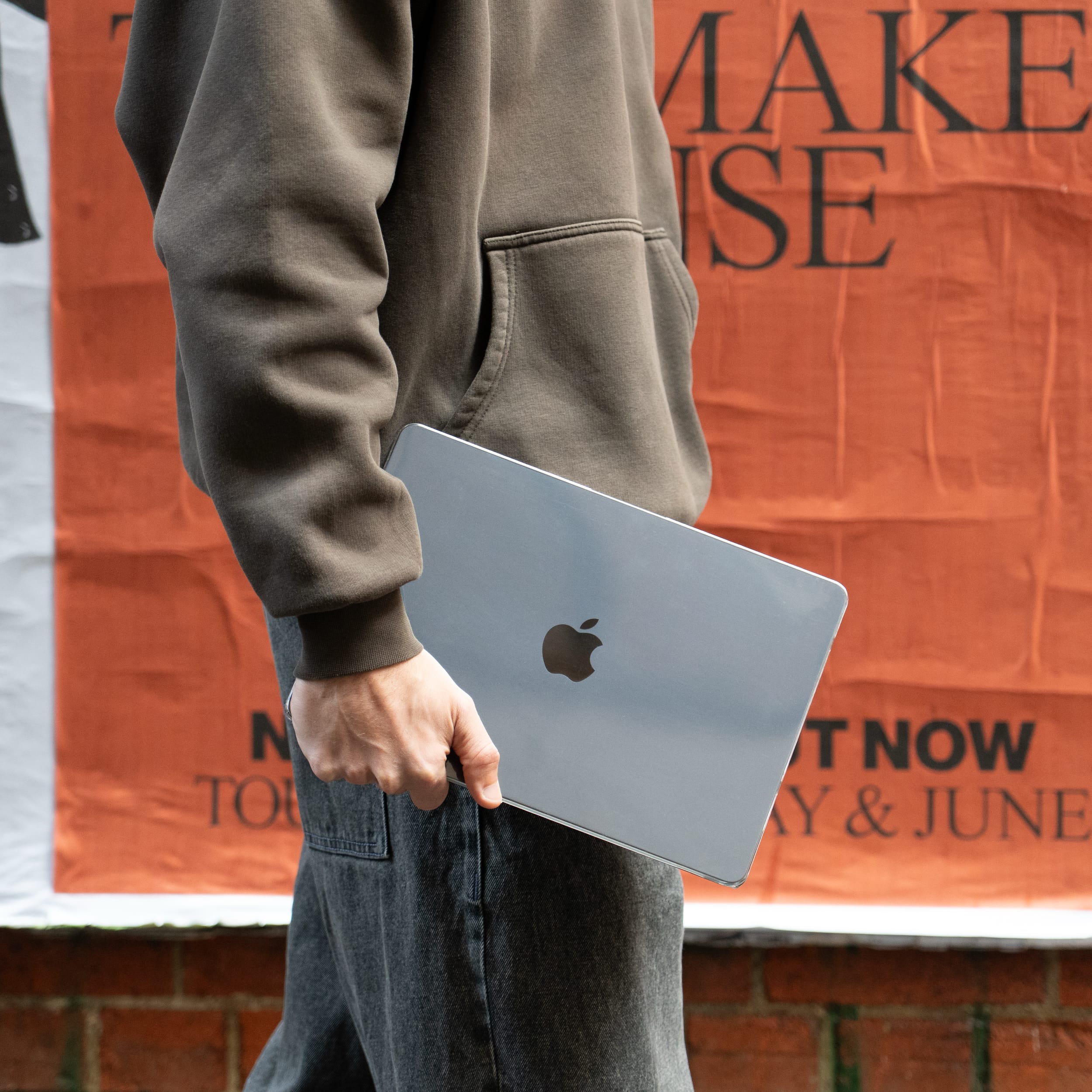 Person holding a MacBook in a clear Humley hard case – sleek and protective design